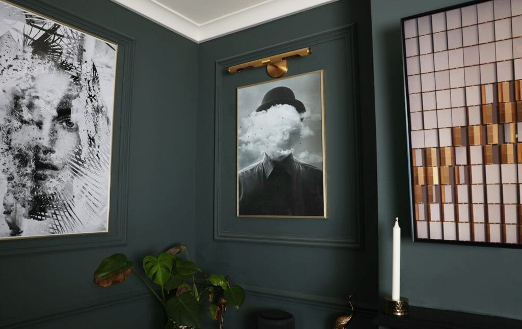 A room with two pictures on the wall